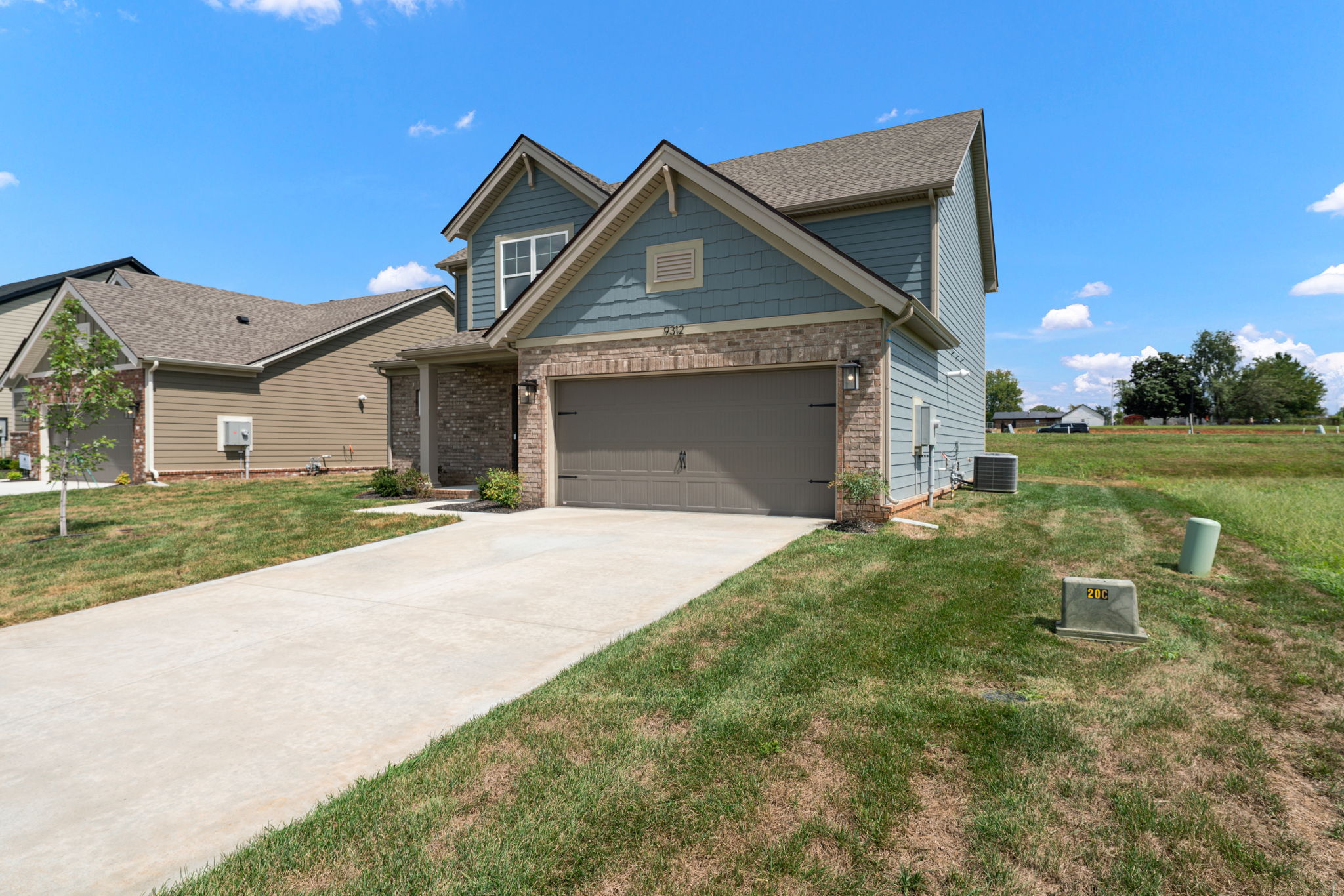 Angled front view of the new construction home at 9312 Woodgate Circle in Alvaton, KY