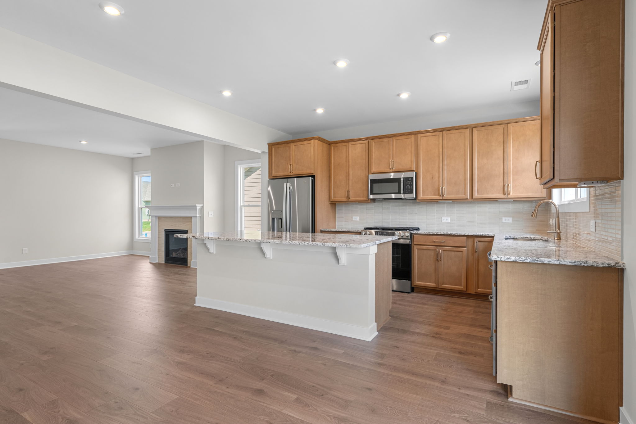Kitchen open to the dining and living areas at 9312 Woodgate Circle in Alvaton, KY
