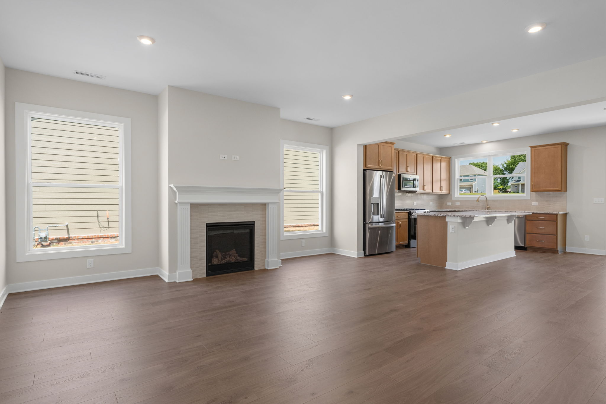 View from the living area toward the kitchen island at 9312 Woodgate Circle in Alvaton, KY