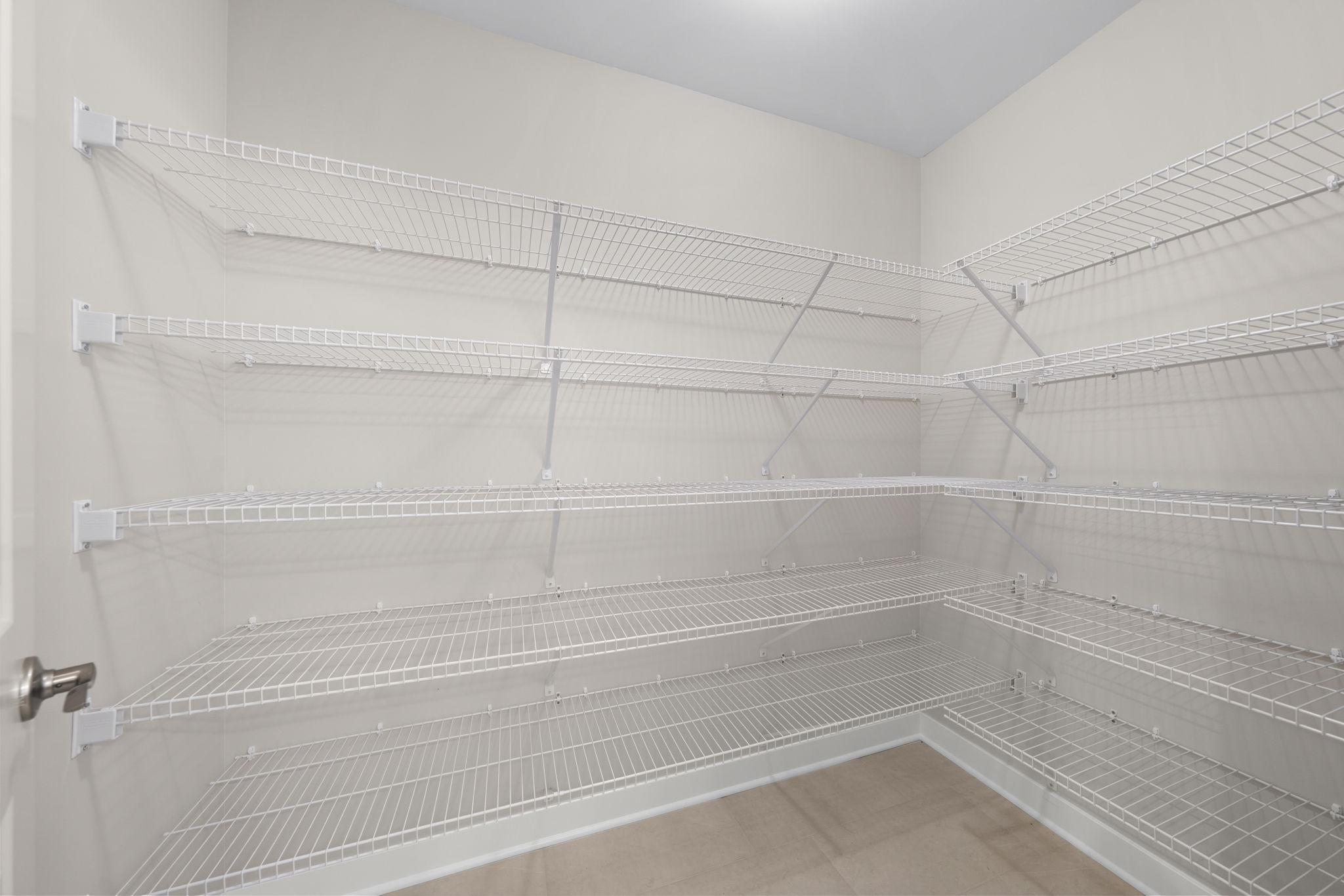 Expanded pantry with full shelving at 9312 Woodgate Circle in Alvaton, KY