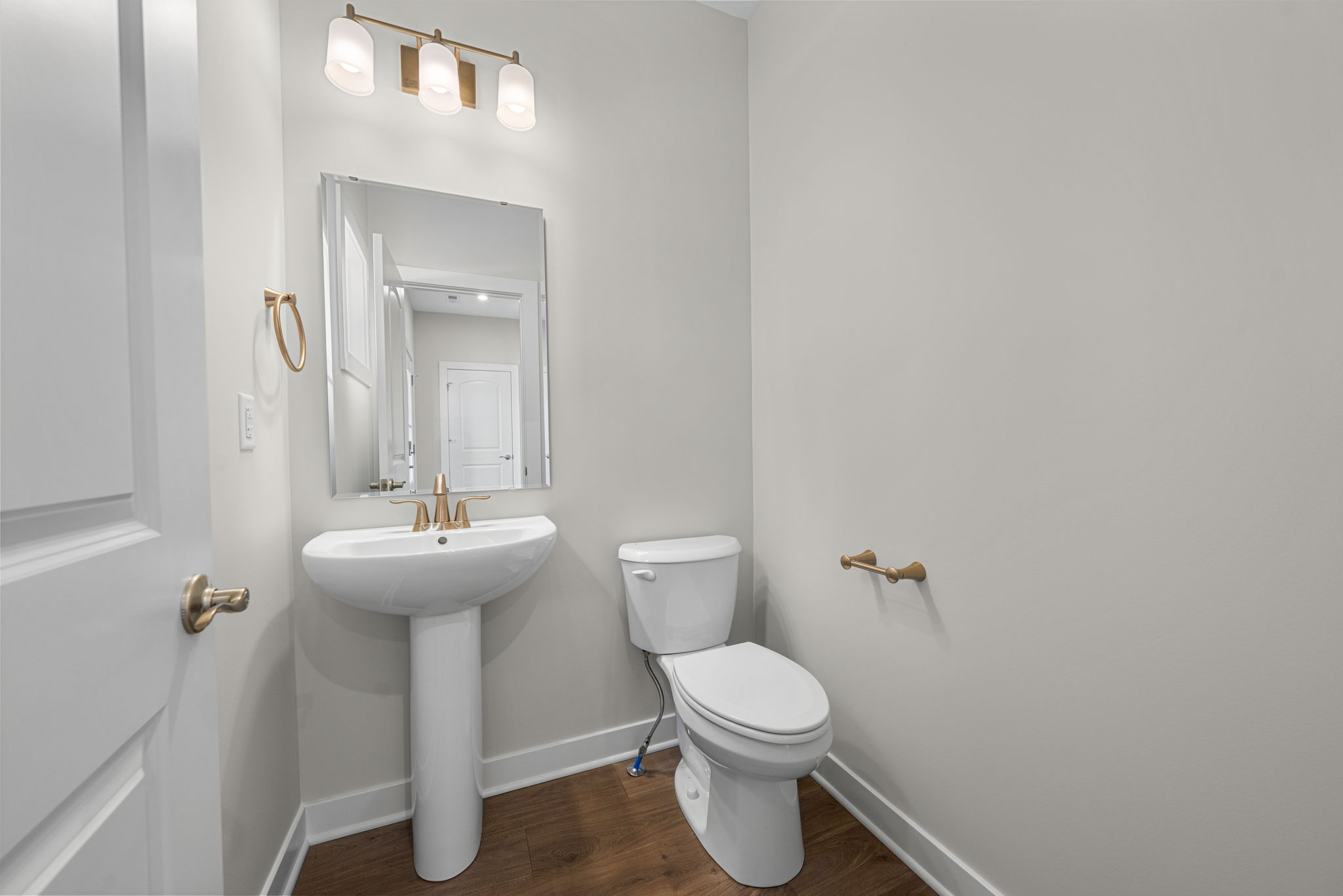 Main-level powder room at 9312 Woodgate Circle in Alvaton, KY