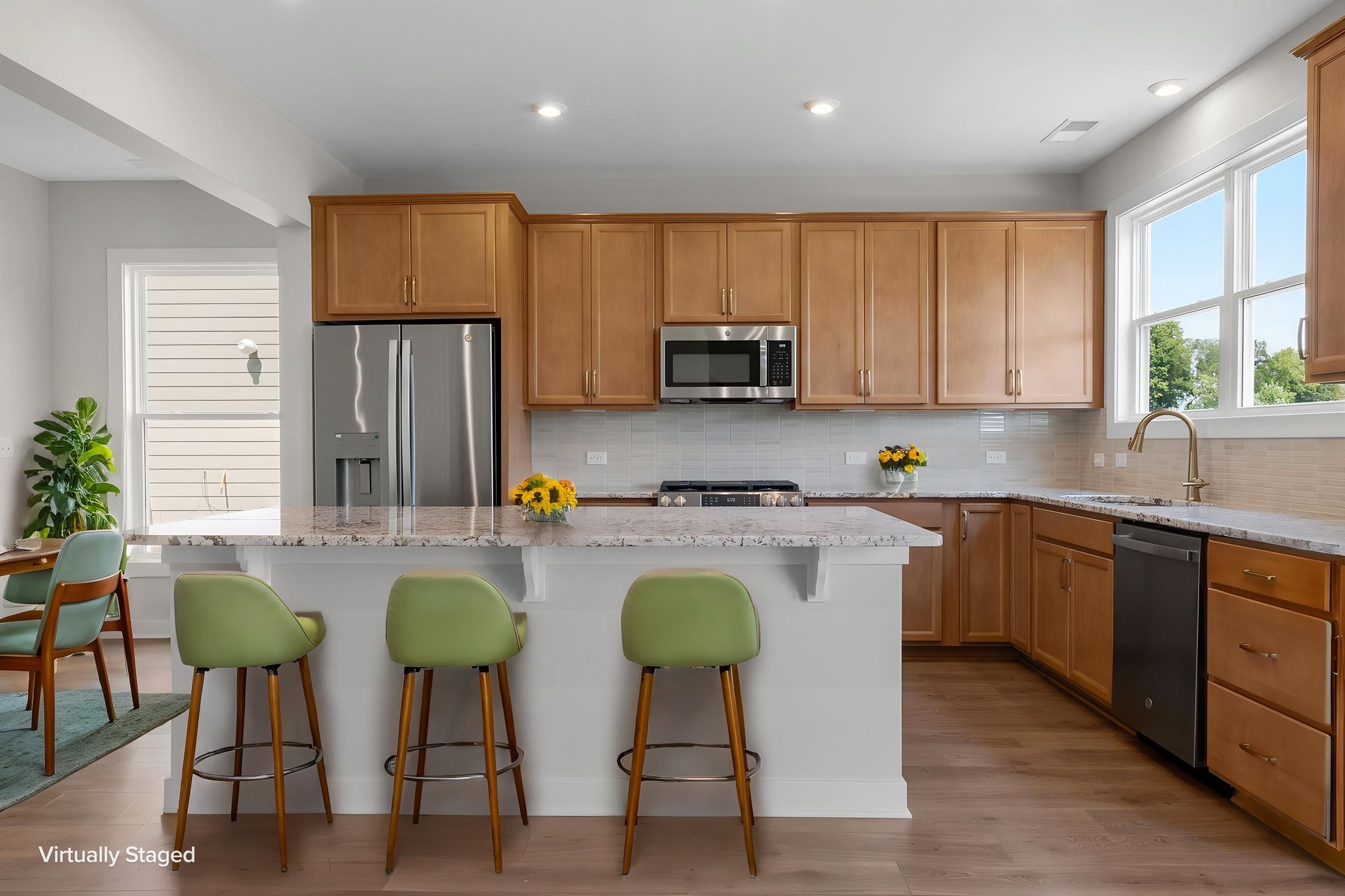 Kitchen island with seating at 9312 Woodgate Circle in Alvaton, KY, virtually staged