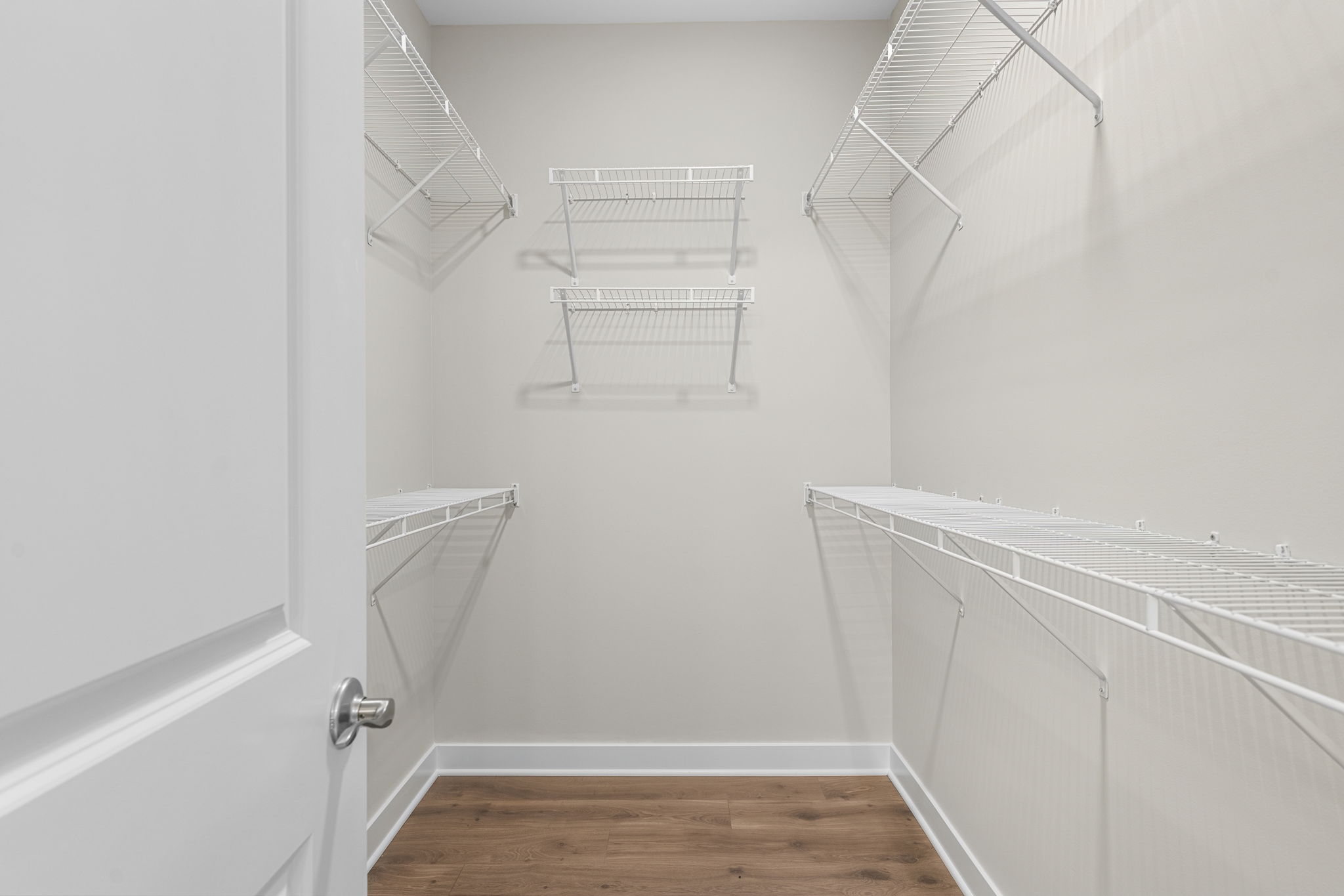 Large primary closet with shelving at 9312 Woodgate Circle in Alvaton, KY