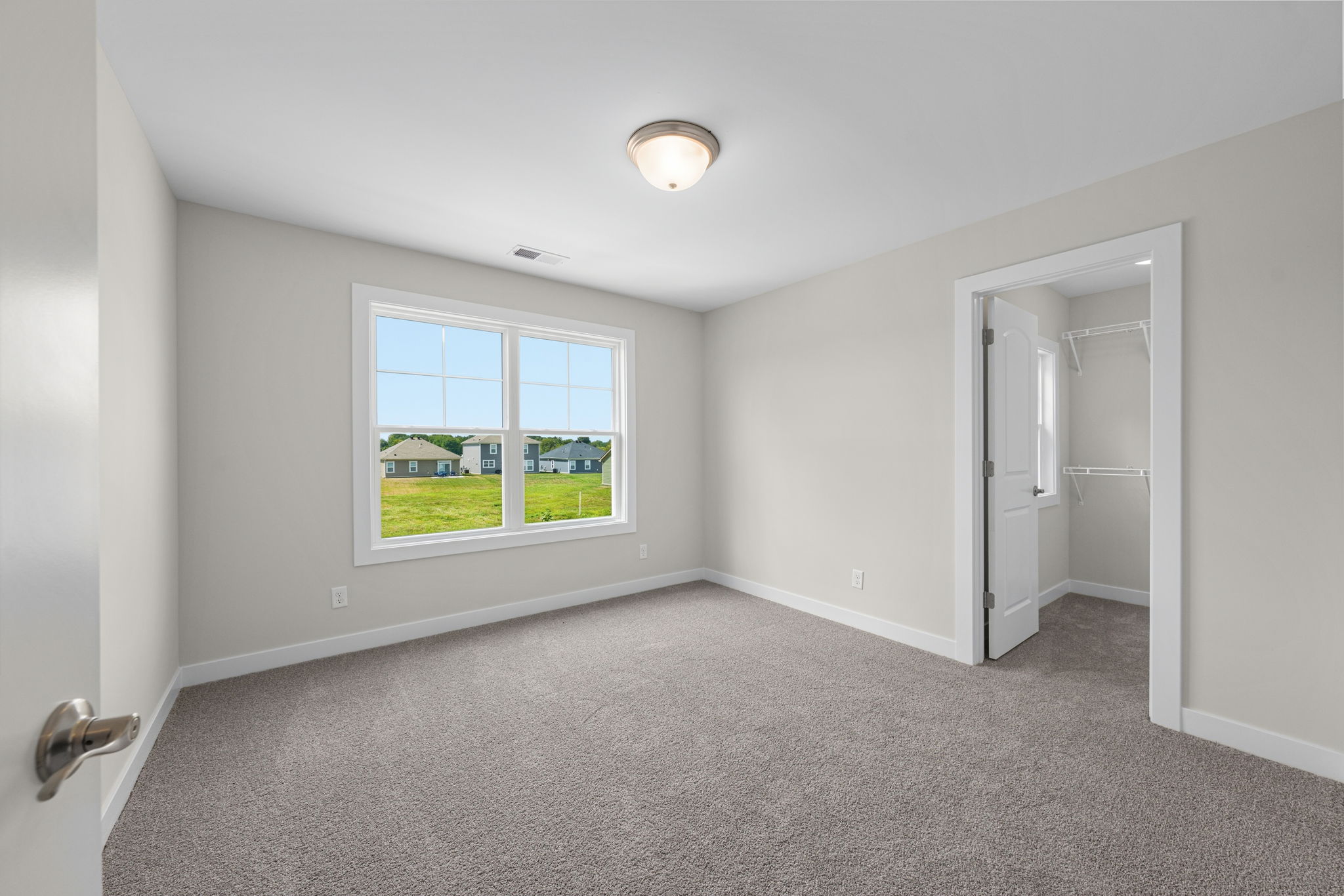 Upstairs bedroom two with walk-in closet at 9312 Woodgate Circle in Alvaton, KY