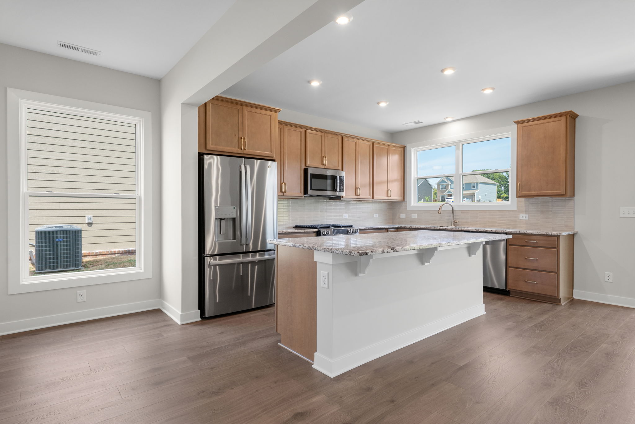 Kitchen island and range wall at 9312 Woodgate Circle in Alvaton, KY
